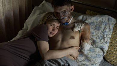 Wife Alina hugs her husband Andriy